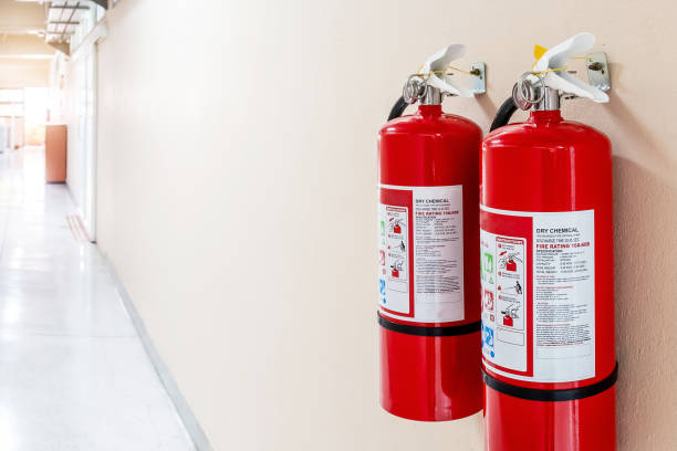 Fire extinguisher system on the wall background, powerful emergency equipment for industrial